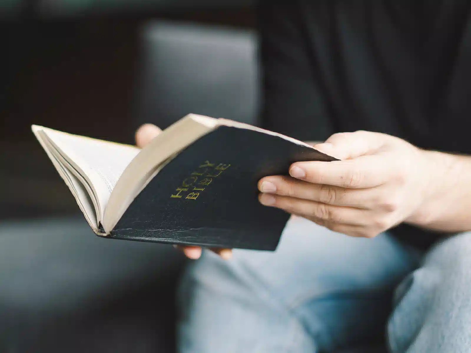 Person holding open Bible